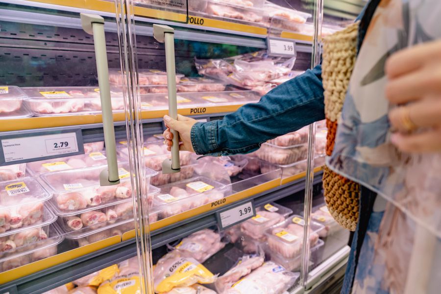 Chicken packs moving through secondary packaging and chilled distribution before reaching retail