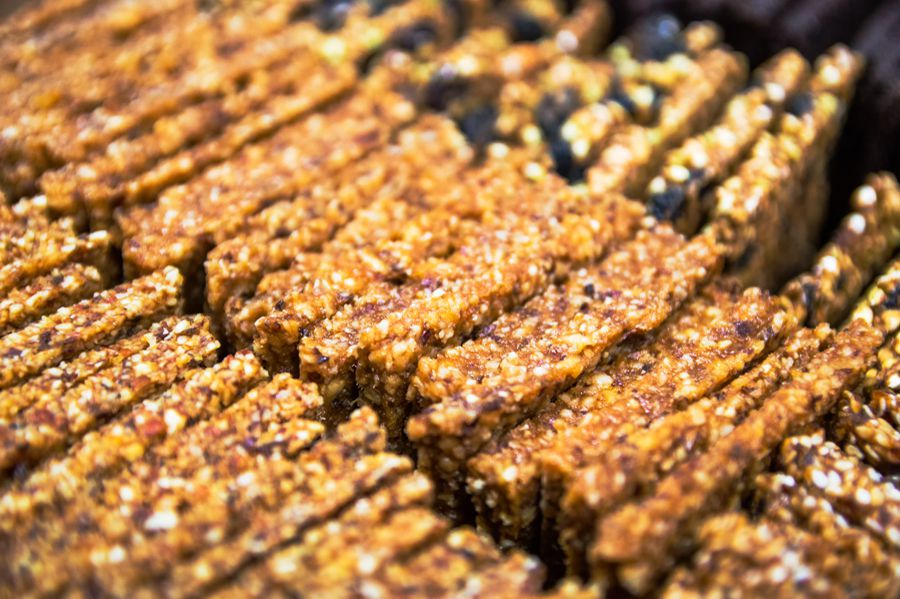 Protein bars moving through automated cartoning and secondary packaging machinery